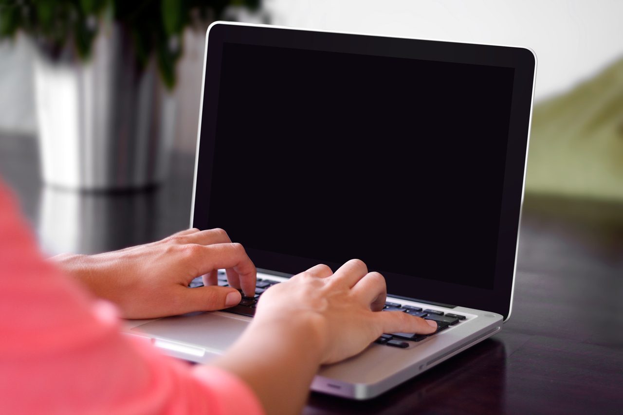 Typing on a laptop (Unsplash)